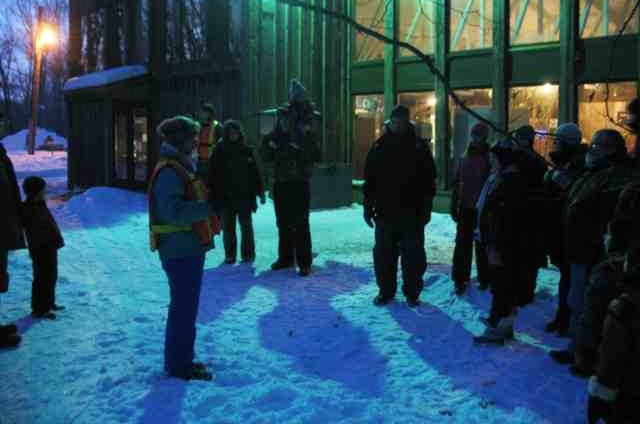 Image of People on a Hike in the snow at night