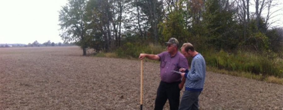 Farmers and staff in field