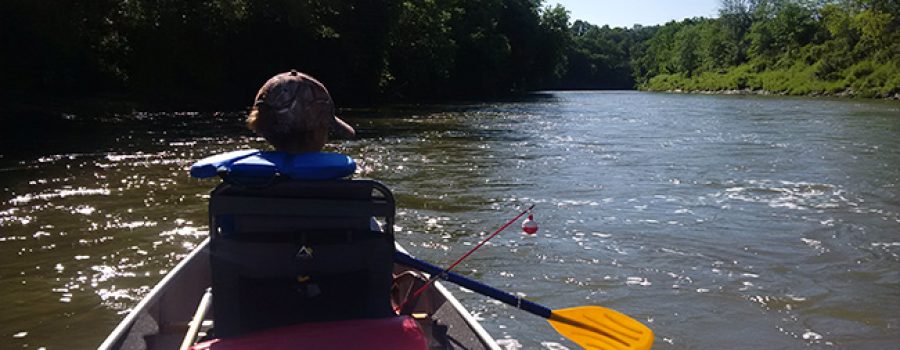 child in canoe on Thames River