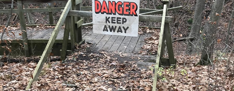 danger sign on trail