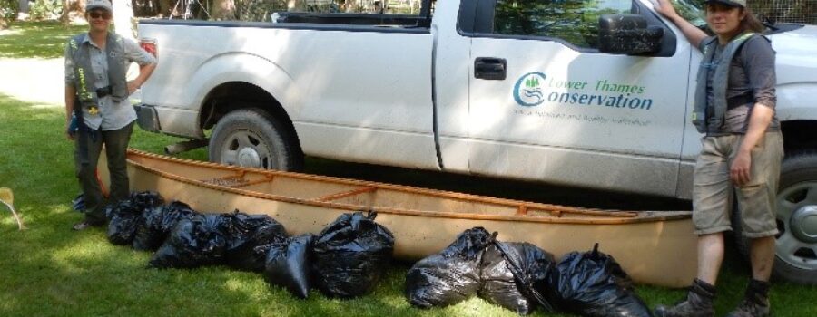 LTVCA’s Wetland Restoration Technician, Anastasia Heuvelmans (left) and SAR team’s Gabriela Carew (right) standing with nine garbage bags full of Water Lettuce.